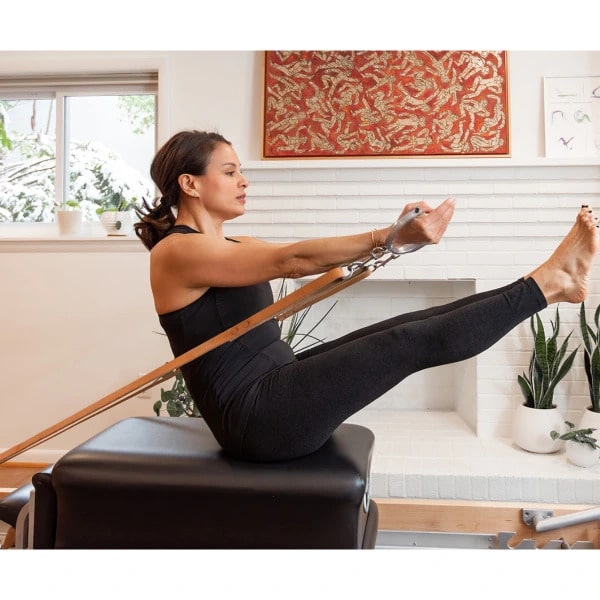 Instructor leading an online Pilates session